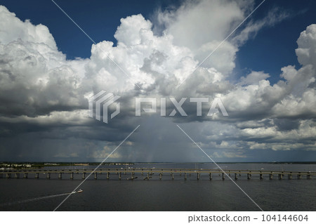 Barron Collier Bridge and Gilchrist Bridge in Florida with moving traffic. Transportation infrastructure in Charlotte County connecting Punta Gorda and Port Charlotte over Peace River 104144604