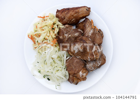 Beautiful fried pieces of pork meat. Pork kebab with vegetables. Meat on a plate. Beautiful fried pieces of pork meat. Pork kebab with vegetables. Meat on a plate. 104144791