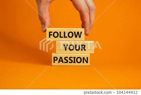 Follow your passion symbol. Concept words Follow your passion on blocks on beautiful orange table orange background. Business, motivation and follow your passion concept. Copy space. Follow your passion symbol. Concept words Follow your passion on blocks on beautiful orange table orange background. Business, motivation and follow your passion concept. Copy space. 104144912