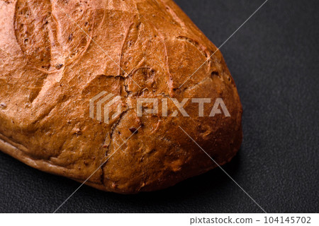 Delicious fresh crispy loaf of white bread with grains and seeds Delicious fresh crispy loaf of white bread with grains and seeds 104145702