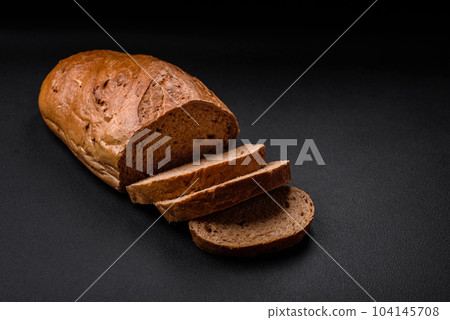 Delicious fresh crispy loaf of white bread with grains and seeds Delicious fresh crispy loaf of white bread with grains and seeds 104145708