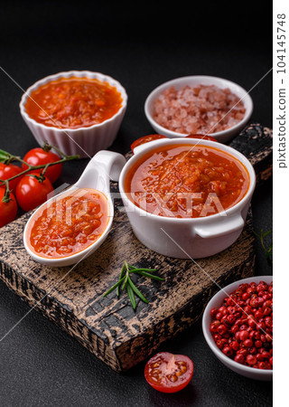 Delicious spicy tomato sauce with pepper, garlic, salt, spices and herbs 104145748