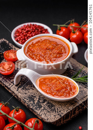 Delicious spicy tomato sauce with pepper, garlic, salt, spices and herbs 104145761