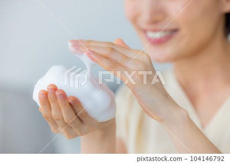 Women washing their face 104146792