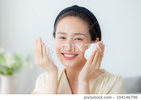 Women washing their face Women washing their face 104146796