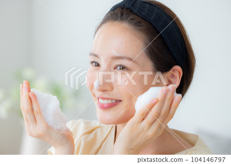 Women washing their face Women washing their face 104146797