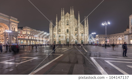 Panorama showing Milan Cathedral and Vittorio Emanuele gallery night timelapse. 104147137