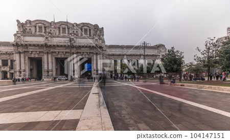 Panorama showing Milano Centrale timelapse - the main central railway station of the city of Milan in Italy. 104147151