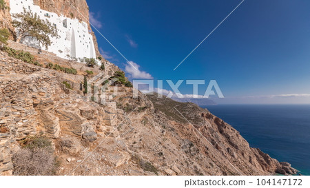 The Hozoviotissa Monastery standing on a rock over the Aegean sea in Amorgos island timelapse hyperlapse, Greece. 104147172