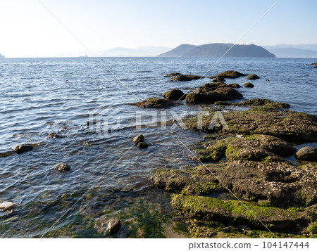 Morning coast of southern Shikanoshima and scenery of Hakata Bay. Morning coast of southern Shikanoshima and scenery of Hakata Bay. 104147444