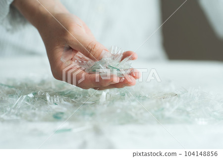 Hand photo with a piece of plastic Hand photo with a piece of plastic 104148856