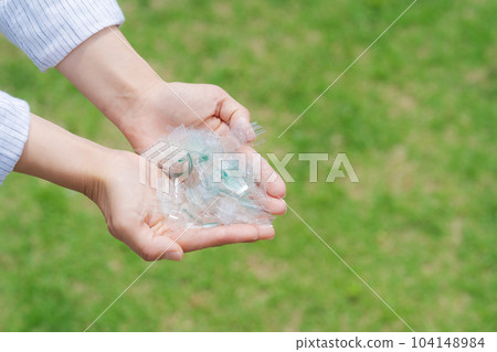 Hand photo with a piece of plastic Hand photo with a piece of plastic 104148984