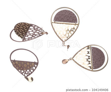 Fashion gold Earrings with beautiful work detail is value. Luxury golden earring is fashion trend and fly in air. White background isolated Fashion gold Earrings with beautiful work detail is value. Luxury golden earring is fashion trend and fly in air. White background isolated 104149406