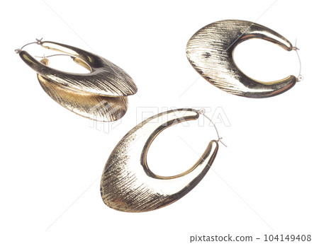 Fashion gold Earrings with beautiful work detail is value. Luxury golden earring is fashion trend and fly in air. White background isolated Fashion gold Earrings with beautiful work detail is value. Luxury golden earring is fashion trend and fly in air. White background isolated 104149408
