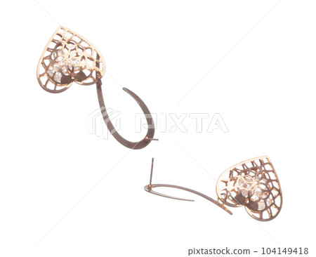 Fashion gold Earrings with beautiful work detail is value. Luxury golden earring is fashion trend and fly in air. White background isolated Fashion gold Earrings with beautiful work detail is value. Luxury golden earring is fashion trend and fly in air. White background isolated 104149418