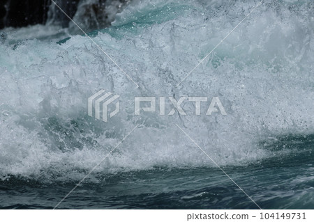 Tropical coast Waves from a distant typhoon Tropical coast Waves from a distant typhoon 104149731
