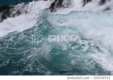 Tropical coast Waves from a distant typhoon Tropical coast Waves from a distant typhoon 104149732