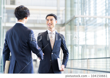 Businessman shaking hands 104150661