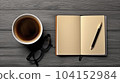 Cup of coffee with notebook, pen on wooden table. Top view and copy space. Generative AI. 104152984