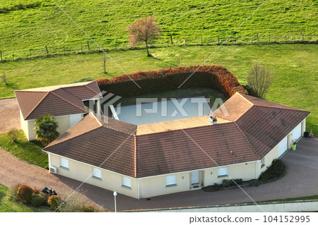 Aerial view of residential houses in green suburban rural area Aerial view of residential houses in green suburban rural area 104152995