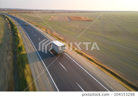 Aerial view of cargo truck driving on highway hauling goods. Delivery transportation and logistics concept 104153298
