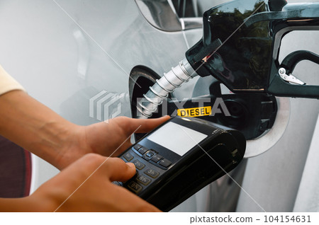 Bank pos ready to pay for a car fuel refueling 104154631