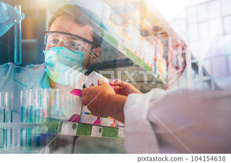 Woman working in the pharmacy looks for the medicine 104154638