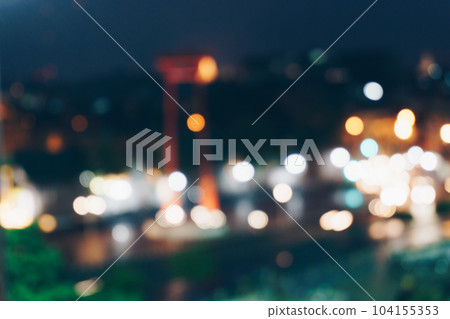 Abstract blurred bokeh city at night with sky and road light 104155353