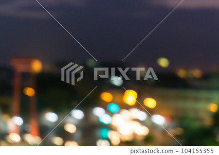 Abstract blurred bokeh city at night with sky and road light 104155355