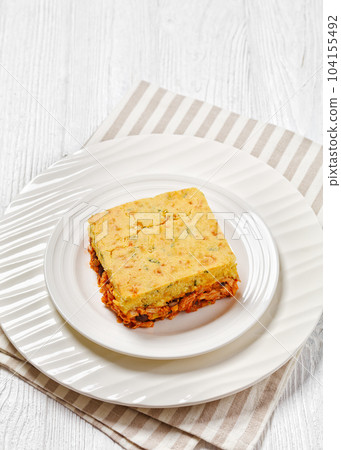 Chicken Tamale Pie on white plate, top view 104155492