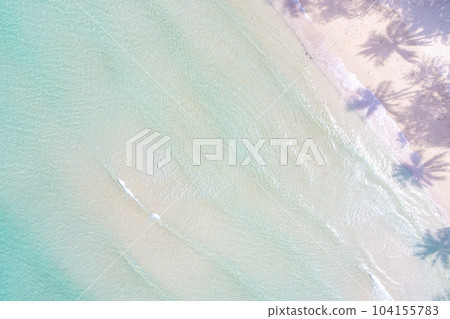 Aerial view azure sea water white sand beach with coconut shadow Aerial view azure sea water white sand beach with coconut shadow 104155783