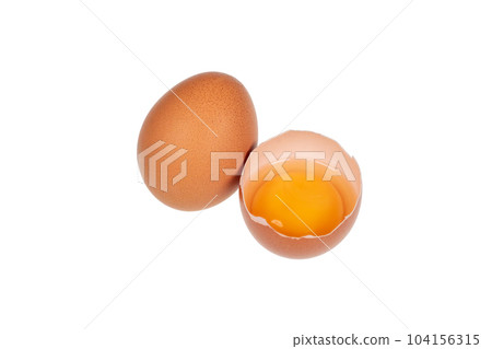 Yolk in an eggshell on a white background. 104156315