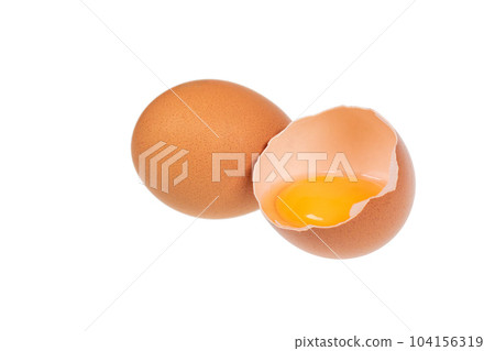Yolk in an eggshell on a white background. Yolk in an eggshell on a white background. 104156319