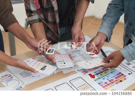 Close up ux developer and ui designer brainstorming interface wireframe design.Creative digital development agency Close up ux developer and ui designer brainstorming interface wireframe design.Creative digital development agency 104156880