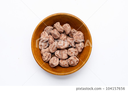 Dried salted Chinese plum on white background 104157656