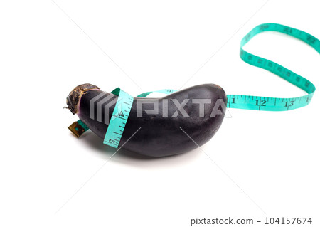 Eggplant with measuring tape on white background. Eggplant with measuring tape on white background. 104157674