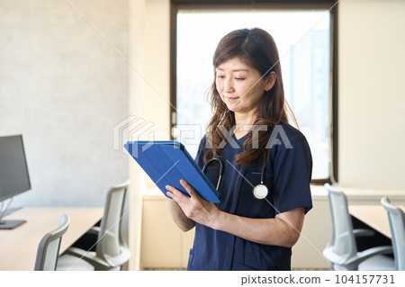 Doctor filling in the medical record 104157731