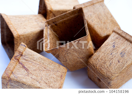 Coco coir pots on white background. Coco coir pots on white background. 104158196