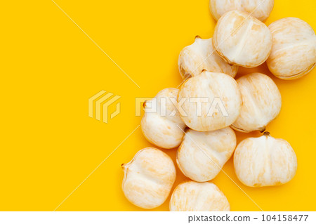Toddy palm on yellow background. 104158477