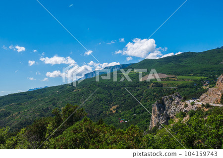 Beautiful green trees grow from the mountain. Beautiful green trees grow from the mountain. 104159743