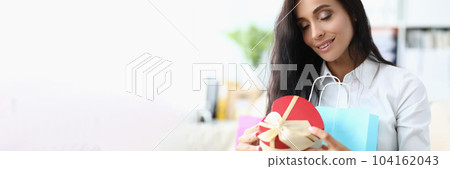 eautiful young woman enjoying gift at home eautiful young woman enjoying gift at home 104162043