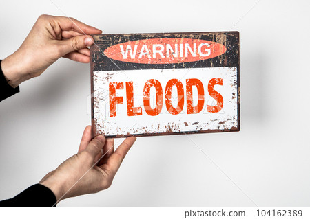 FLOODS. Warning sign with text on a white background FLOODS. Warning sign with text on a white background 104162389