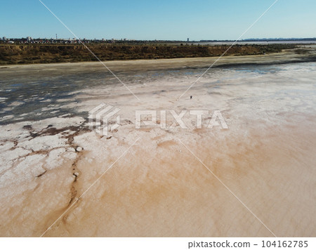 A view of the Dead Sea and its salty shores in Odessa. salt patterns on water A view of the Dead Sea and its salty shores in Odessa. salt patterns on water 104162785