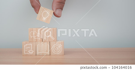 Education concept image. Creative idea and innovation. boy sitting staring at computer and there is a light bulb icon next to it. Education concept image. Creative idea and innovation. boy sitting staring at computer and there is a light bulb icon next to it. 104164016
