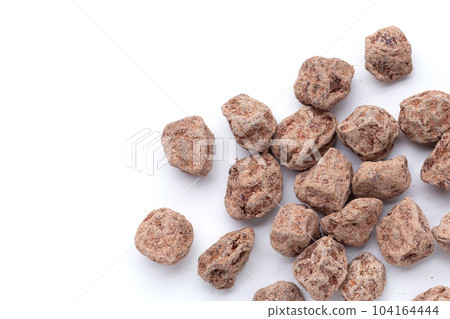Dried salted Chinese plum isolated on white background Dried salted Chinese plum isolated on white background 104164444