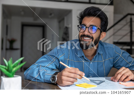 Man working on papers of the construction project Man working on papers of the construction project 104165907