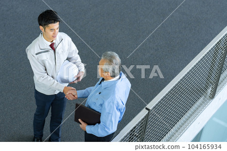 Business man in work clothes handshake 104165934