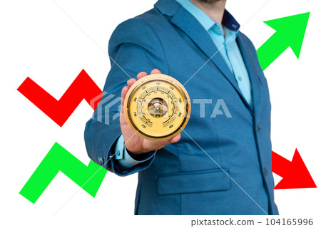 A businessman holds a barometer in his hands against the background of a red and green arrow. Risk, fluctuation in stock market and cryptocurrency. 104165996