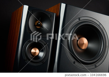 Multimedia acoustic sound speakers. Sound audio system on dark background. Stereo system for listening music 104166696