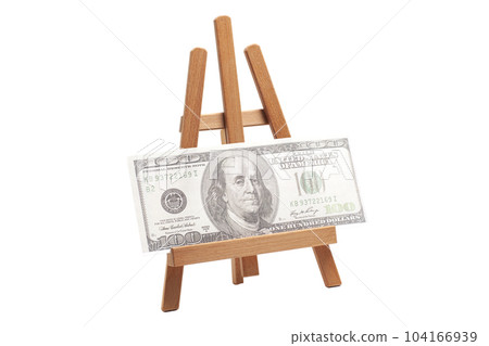 Artist wooden easel with one hundred dollars isolated on white 104166939